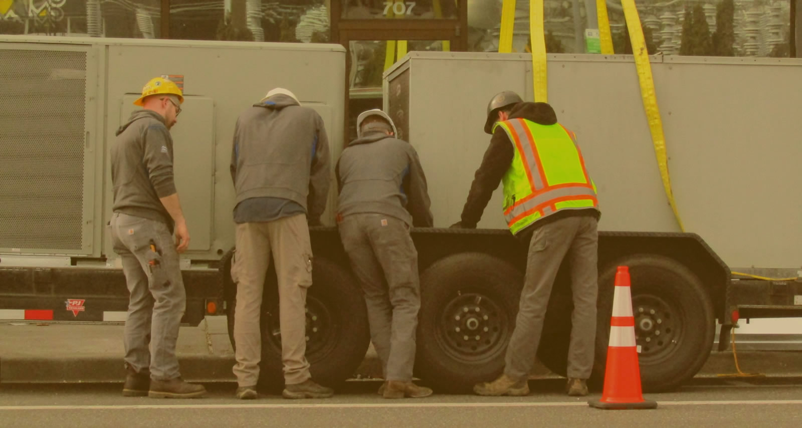 Crew guiding equipment into place